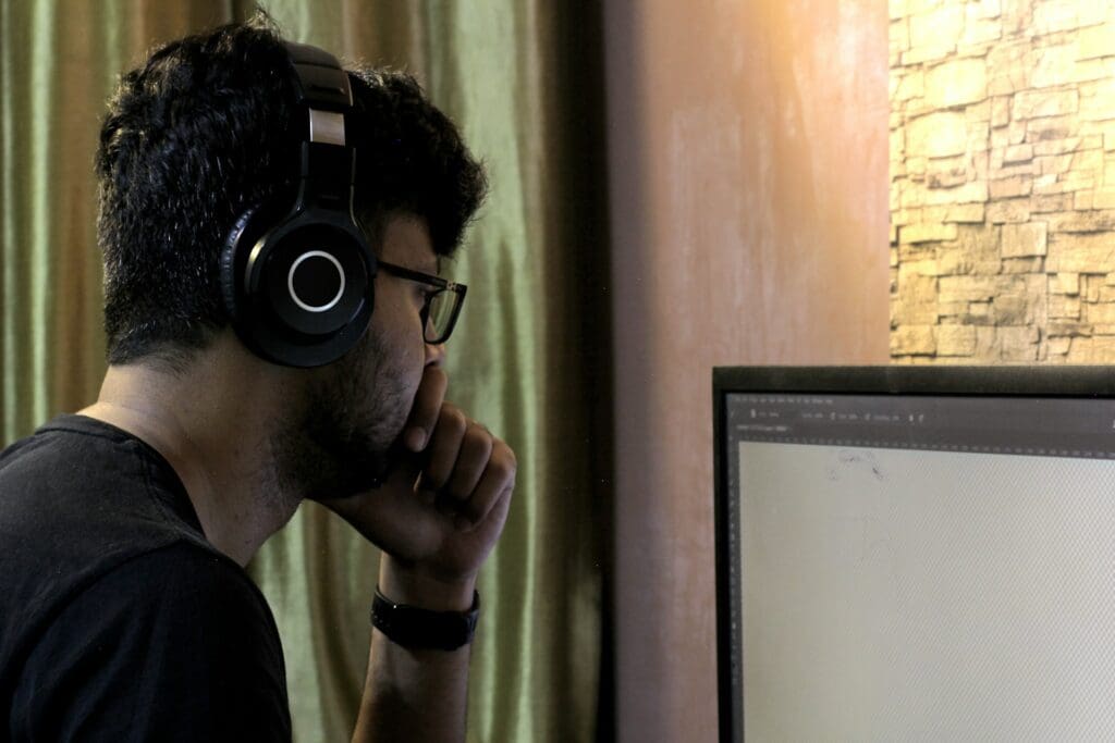 man browsing web app on computer