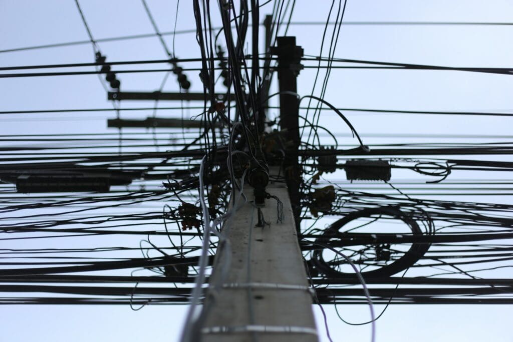tangled wires as a humorous reference to how messy internal workflows are and how businesse must identify them to properly automate